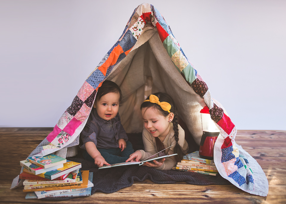 Siblings reading in a quilt tent | Bethesda, MD Newborn Baby and Family Photographer Tonya Teran Photography